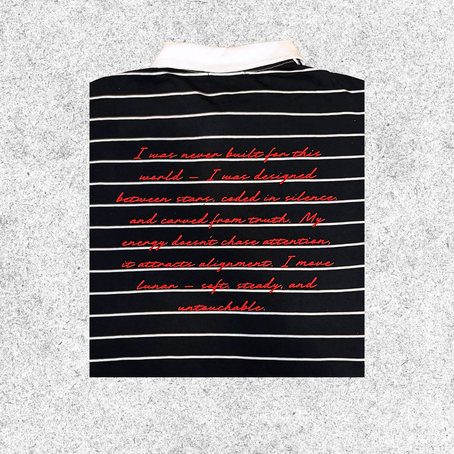 Black and white striped shirt with red text, closer view.