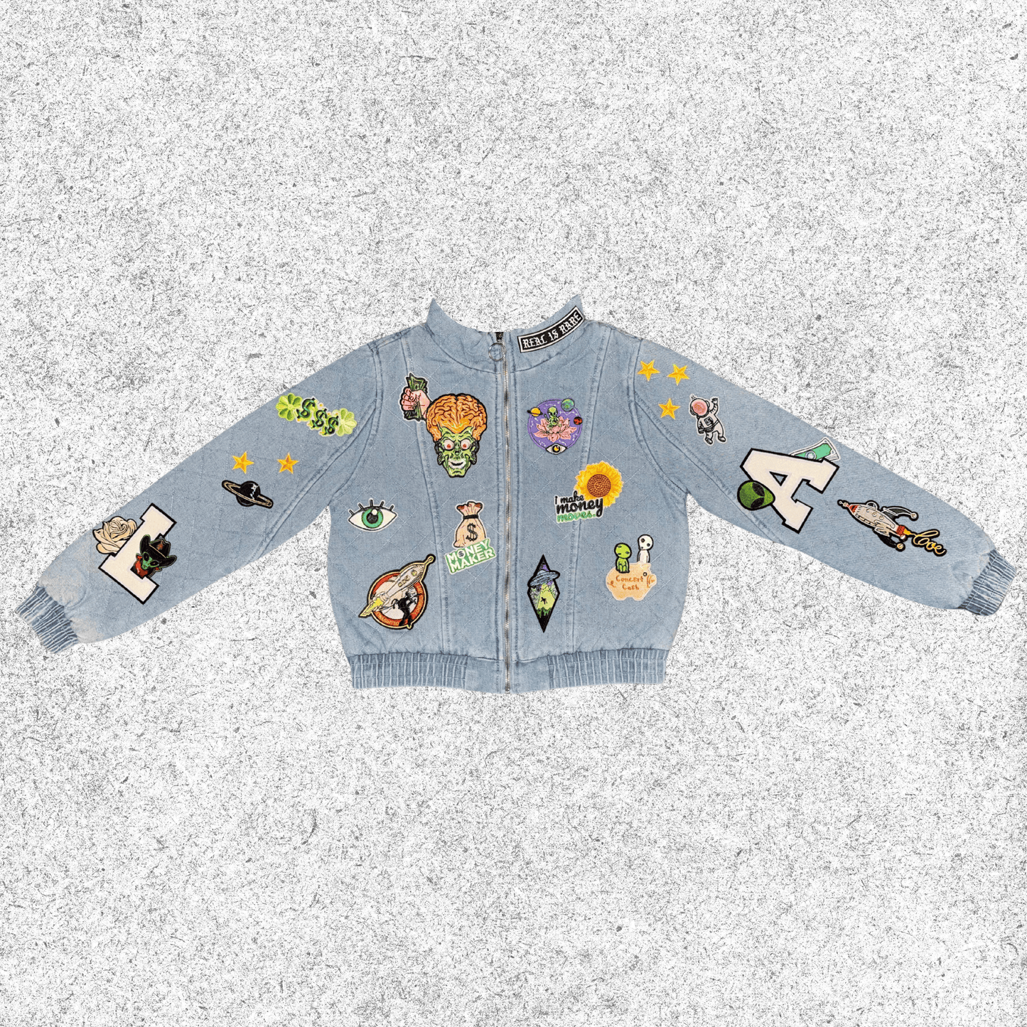 Light blue jacket with various colorful cosmic themed patches , quilted bomber front view.
