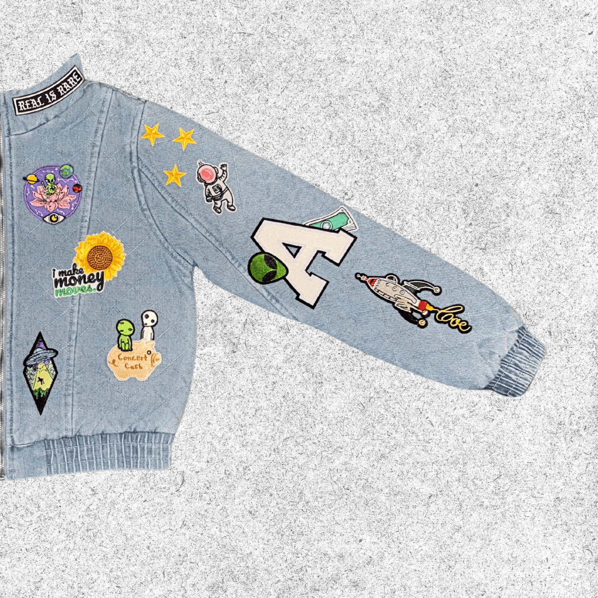 Light blue denim jacket with various colorful patches closer view.