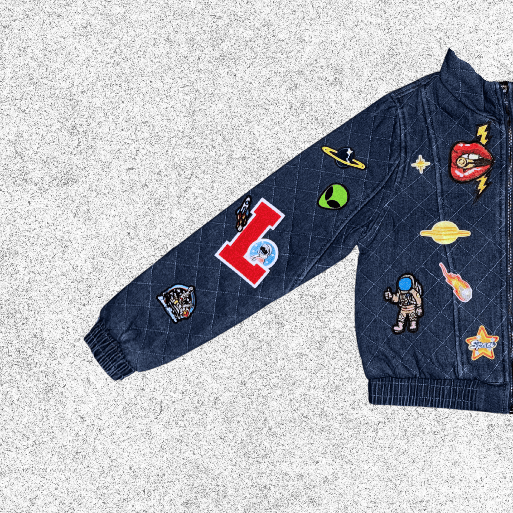 Navy blue jacket with various colorful patches closer view. 