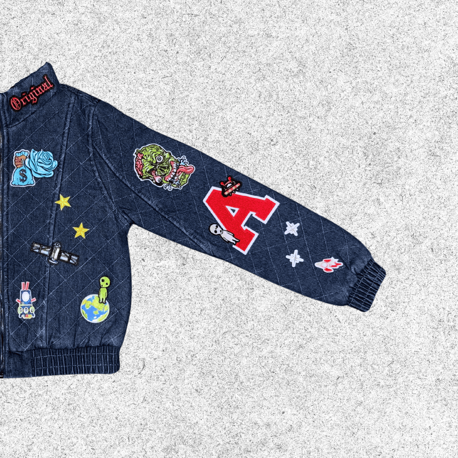 Blue denim jacket with various patches closer view.